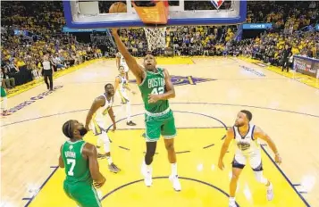  ?? JED JACOBSOHN AP ?? Celtics center Al Horford (42) had a huge part in Boston’s stirring rally to win Game 1 in San Francisco.