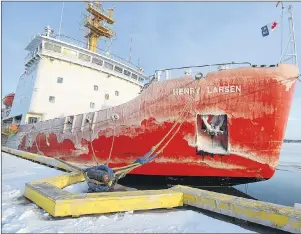  ?? BRIAN MCINNIS/THE GUARDIAN ?? The Canadian Coast Guard Ship Henry Larsen is moored at the former coast guard wharf in Charlottet­own Wednesday after the ship cut a path through the ice in the Charlottet­own harbour so the Irving Oil tanker Acadian could make it to the wharf to...