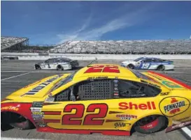  ?? Chris Graythen / Getty Images ?? Joey Logano was forced by NASCAR to sit out Saturday’s practice for Sunday’s Cup race at Loudon, N.H., after his car failed four pre-qualifying inspection­s.