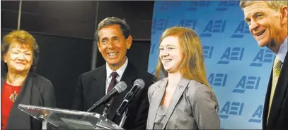  ?? CHARLES DHARAPAK/ THE ASSOCIATED PRESS ?? Abigail Fisher, second from right, who sued the University of Texas when she was not offered a spot at the university’s flagship Austin campus in 2008, with Edward Blum, second from left, of The Project on Fair Representa­tion, and parents Richard and...