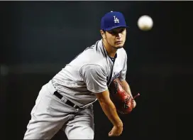  ?? ROSS D. FRANKLIN / AP ?? Pitcher Yu Darvish joined a Dodgers team that was very good before they acquired him. His addition now makes the Dodgers the World Series favorites.