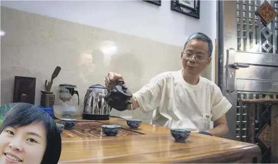  ??  ?? Zhi- Ping Lai in his Guangzhou home. He lost his only daughter, 27- year- old Chang Lai ( inset), in the collapsed CTV building.