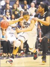  ?? Hearst Connecticu­t Media file photo ?? UConn’s Maya Moore drives to the basket against Purdue’s Antionette Howard in a second-round NCAA Tournament game March 22, 2011.