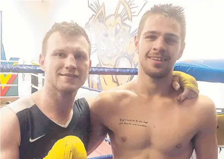  ??  ?? GOOD EXPERIENCE: Benjamin Hussain (right) after a sparring session with former world champion Jeff Horn.