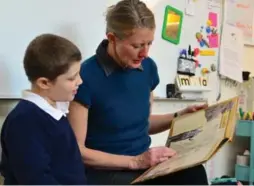  ?? JON NICHOLLS FOR THE TORONTO STAR ?? Henry Sperling, 9, and his teacher, Liz Noble, read together at Claremont School.
