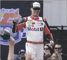  ?? AP PHOTO/STEVE HELBER ?? Kevin Harvick greets fans during driver introducti­ons prior to the start of a NASCAR Cup Series auto race at Richmond Raceway on Aug. 14, 2022, in Richmond, Va.