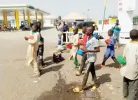  ??  ?? Almajirai at a filling station in Zaria