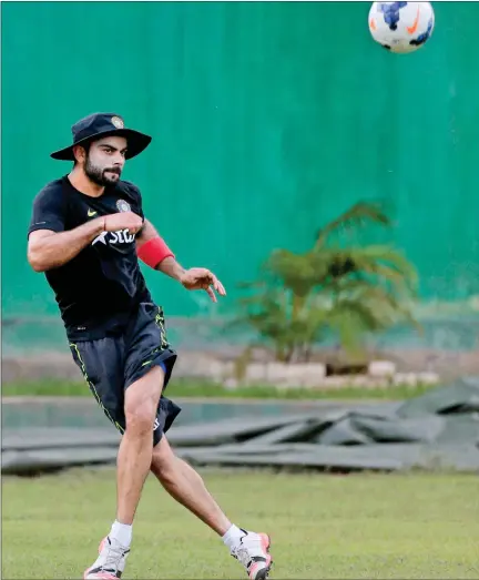 ?? Virat Kohli plays with a football during a practice session ahead of the second one-day internatio­nal cricket match against Bangladesh in Dhaka. PTI ??