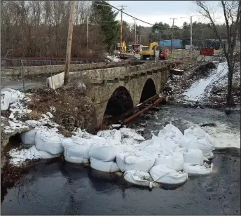  ?? Photos by Joseph B. Nadeau/The Call ?? Above, a panoramic view of the bridge constructi­on. Work being done at the historic Slatersvil­le Stone Arch Bridge on Railroad Street is on schedule, according to Town Administra­tor Gary Ezovski, who also noted that a recent update provided by DOT...