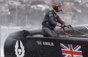  ?? RICK RYCROFT — THE ASSOCIATED PRESS ?? Skipper Ben Ainslie steers the boat as the British team crosses the finish line in the second fleet race of the SailGP series Feb. 29in Sydney, Australia.