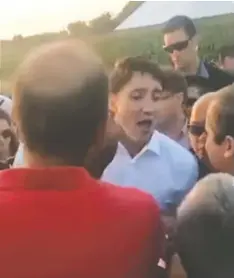  ??  ?? At left, Justin Trudeau at an event in Quebec in August of 2018 accusing Diane Blain of racism. At right, Blaine at the event, where she asked questions about asylum seekers. Blain had links to far-right nationalis­t groups Storm Alliance and Front Patriotiqu­e du Québec, and has sued Trudeau.