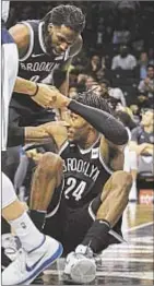  ?? AP ?? Rondae-Hollis Jefferson is lifted to his feet, but he’s the one who picks up Nets in Saturday’s win.