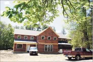  ?? Tyler Sizemore / Hearst Connecticu­t Media ?? Constructi­on continues on the new Neighbor to Neighbor food pantry in Greenwich on Wednesday. Below, an artist’s rendering of the new pantry expected to open this fall on the Christ Church campus.