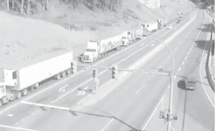  ?? DRIVE B.C. ?? Vehicles line up on the Trans-Canada Highway at West Shore Parkway, looking south toward Victoria, after Thursday’s crash.