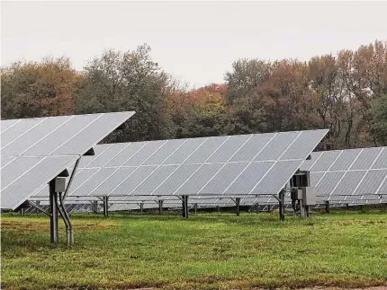  ?? Leslie Hutchison/Hearst Connecticu­t Media ?? A solar array at White Flower Farms in Litchfield County. The American Farmland Trust surveyed more than 175 Connecticu­t farmers, with a majority stating they would consider “dual-use” solar installati­ons that allowed for the continuing use of farmland below or around panel arrays.