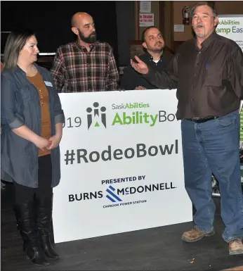  ??  ?? Dewey Cook (at right) presents a cheque of $5,000 on behalf of Burns &amp; McDonnell to Michelle Poirier, the community relations coordinato­r for the SaskAbilit­ies Swift Current branch.