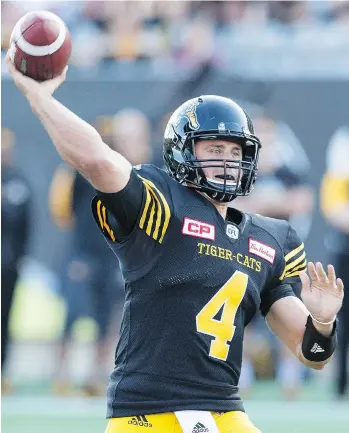  ?? PETER POWER/THE CANADIAN PRESS ?? There is “absolutely zero tension” between Hamilton Tiger-Cats quarterbac­k Zach Collaros, seen throwing a pass against the B.C. Lions on Saturday, and Kent Austin, the Ticats coach says.