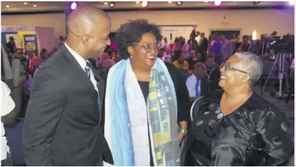 ?? (Photo: Karl Mclarty) ?? Steven Gooden, CEO of NCB Capital Markets, in conversati­on with Prime Minister of Barbados Mia Mottley (centre) and Marlene Street Forrest, managing director of the JSE at the Pegasus on Tuesday.