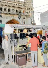  ??  ?? Tourists keep their luggages with a private contractor outside Charminar. — Deccan Chronicle