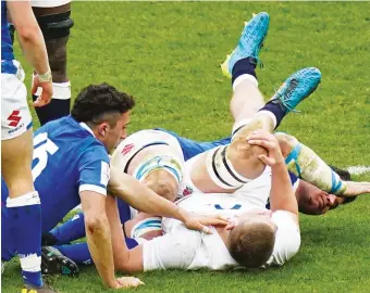  ??  ?? This should stop: England flanker Jack Willis is injured against Italy in the Six Nations, on his feet at a ruck and taken out low by Sebastian Negri