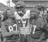  ?? DAVID ZALUBOWSKI/AP ?? Texans wide receiver Demaryius Thomas stands with his parents, Bobby Thomas, right, and Katina Smith prior to the team's game against the Broncos on Nov. 4, 2018, in Denver. Thomas was found dead in his suburban Atlanta home Thursday night.