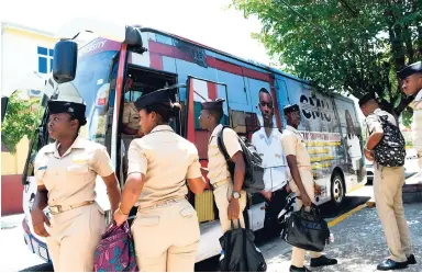  ?? NORMAN GRINDLEY/CHIEF PHOTO EDITOR ?? Students from Caribbean Maritime University arrive at Duke Street, Kingston, to assist with administra­tive duties at St Aloysius Primary and St George’s Girls’ Primary and Infant as mass teacher absences shut down schools for three days.