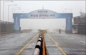  ?? AHN YOUNG-JOON — THE ASSOCIATED PRESS ?? A South Korean army soldier walks on Unificatio­n Bridge, which leads to the demilitari­zed zone, near the border village of Panmunjom in Paju, South Korea, Wednesday.