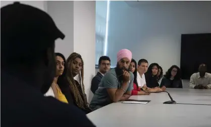  ??  ?? New Democratic Party leader Jagmeet Singh listens to people tell their stories about racism during a campaign stop in Toronto in September. Photograph: Adrian Wyld/AP