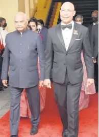  ?? ?? Governor General of Jamaica, Sir Patrick Allen (right) was dapper in a tuxedo as he escorted Ram Nath Kovind, president of India to the ball room.