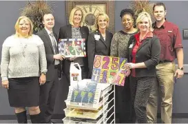  ?? Cy-Fair ISD ?? Representa­tives from SpringHill Suites by Marriott and Cypress-Fairbanks Independen­t School District review the hotel’s art supply donations to Bleyl Middle School. From left are SpringHill Suites by Marriott sales director Olga Maciques; SpringHill...