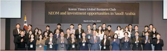  ?? Korea Times photo by Choi Won-suk ?? Participan­ts of The Korea Times Global Business Club, held under the title “NEOM and investment opportunit­ies in Saudi Arabia,” applaud at Korea Press Center in Seoul, Tuesday. In the front row, seventh from right, is Sami M. Alsadhan, ambassador of Saudi Arabia to Korea, and in the front row, eighth from right, is Oh Young-jin, president and publisher of The Korea Times.