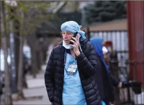  ??  ?? A nurse makes a phone call during a break outside the Wyckoff Heights Medical Center during the outbreak of the coronaviru­s disease (COVID-19) in the Brooklyn borough of New York City, New York, US, on Friday. REUTERS