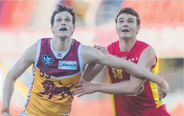  ?? Picture: NEAFL ?? AIMING HIGH: Gold Coast Suns academy player Caleb Graham (right) has his eye on next month’s AFL draft.