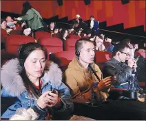  ?? PROVIDED TO CHINA DAILY ?? Visually impaired people experience a movie at Shanghai’s Red Star Cinema.