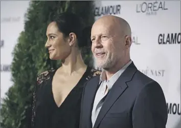  ?? NDZ/Star Max ?? ACTOR Bruce Willis and his wife, Emma Heming Willis, attend the Glamour Woman of the Year Awards in New York in 2014. His condition can lead to struggles with decision-making, speaking and comprehens­ion.