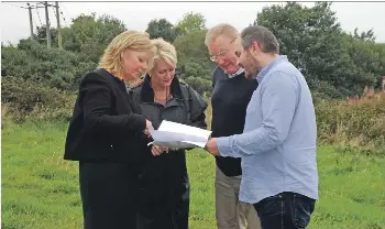  ??  ?? Yvonne Baulk and Joe Cullinane of North Ayrshire Council at the Arran site with Tom Tracey and Sheena Borthwick of the Arran Economic Group.