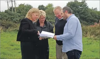  ??  ?? Yvonne Baulk and Joe Cullinane of North Ayrshire Council at the Arran site with Tom Tracey and Sheena Borthwick of the Arran Economic Group.