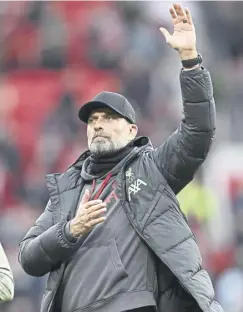  ?? ?? Jurgen Klopp salutes the Liverpool players and fans at full time