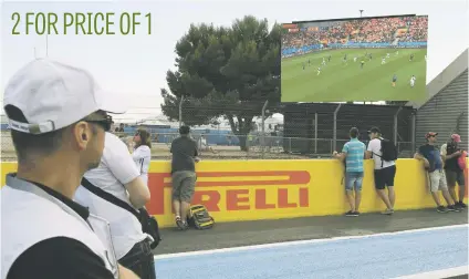  ?? Picture: AFP ?? Formula One fans watch the World Cup match between France and Peru on a large screen at the Circuit Paul Ricard in Le Castellet on Thursday ahead of the French Grand Prix.