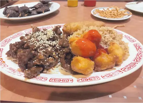  ?? JASON K. WATKINS/FOR THE JOURNAL ?? The sesame beef and sweet-and-sour chicken is served with fried rice at Ho-Lo-Ma Chinese Restaurant.