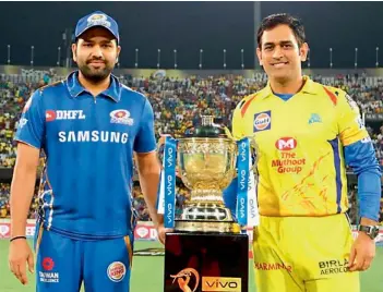  ??  ?? Chennai Super Kings captain M. S. Dhoni (right) and his Mumbai Indians counterpar­t Rohit Sharma in this file photo.