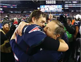  ??  ?? Patriots quarterbac­k Tom Brady, left, and coach Bill Belichick celebrate a win.