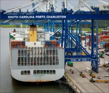  ?? Dustin Chambers/New York Times ?? A cargo ship docks at the port of Charleston, a hub for global trade, in July 2018. Global trade wars have sowed uncertaint­y in South Carolina, which has an exports-driven economy.