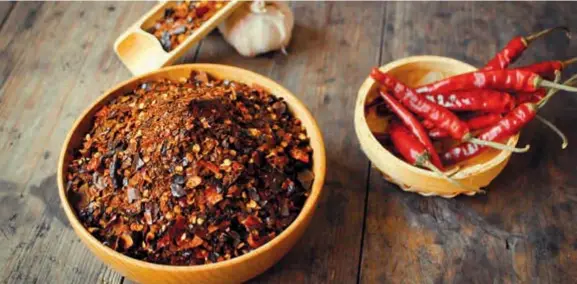 ??  ?? Guizhou cuisine is known for highly intense spicy flavors, and roasted chili condiment is one of the local signatures. — All photos by Hellorf