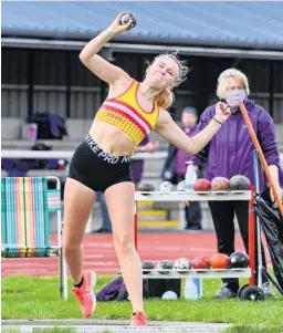  ??  ?? Giving it her all
Lucy McCormack’s attempt in the shot put for Law AAC