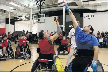  ?? Signal file photo ?? Rugby players fight for a jump ball at the last year’s Wheelchair Sports Festival in Santa Clarita.