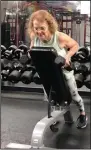  ?? (Arkansas Democrat-Gazette/Celia Storey) ?? Beverly Lindberg focuses on not shrugging her shoulders while doing the Incline Alternatin­g Iso Row at Little Rock Athletic Club.