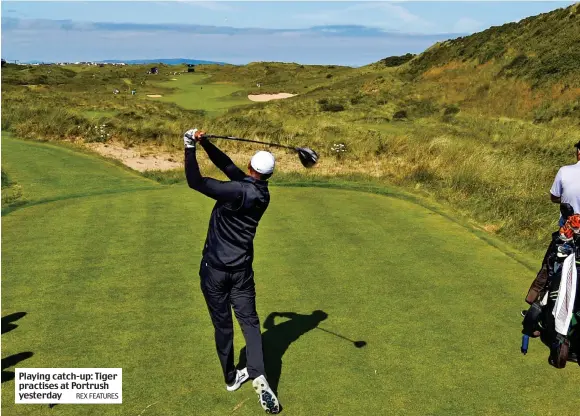  ?? REX FEATURES ?? Playing catch-up: Tiger practises at Portrush yesterday