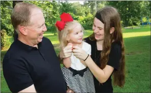  ?? MARK BUFFALO/TRILAKES EDITION ?? Mark Rash, left, is shown with his 2-year-old granddaugh­ter, Emory Bell Elledge, and his youngest daughter, Mackenzie, 16.