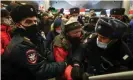  ?? Photograph: Sergei Bobylev/TASS ?? Police officers detain a man at Vnukovo internatio­nal airport where Alexei Navalny had been expected to land.